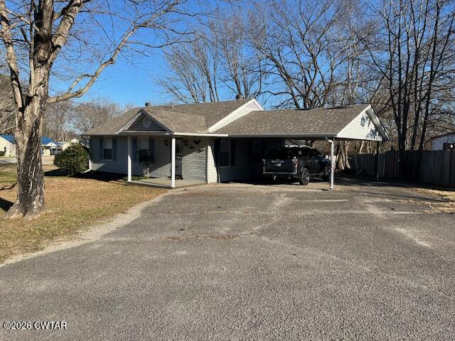 4036 Hawthorne Street Milan, TN 38358 - Photo 10 of 13 a view of a house with a yard and a large tree