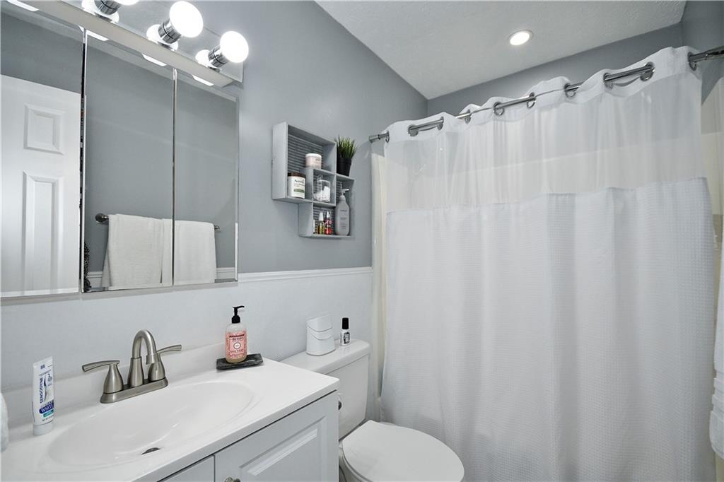 1125 Valleyview Drive Lawrence, PA 15055 - Photo 25 of 35 a bathroom with a sink vanity mirror and toilet
