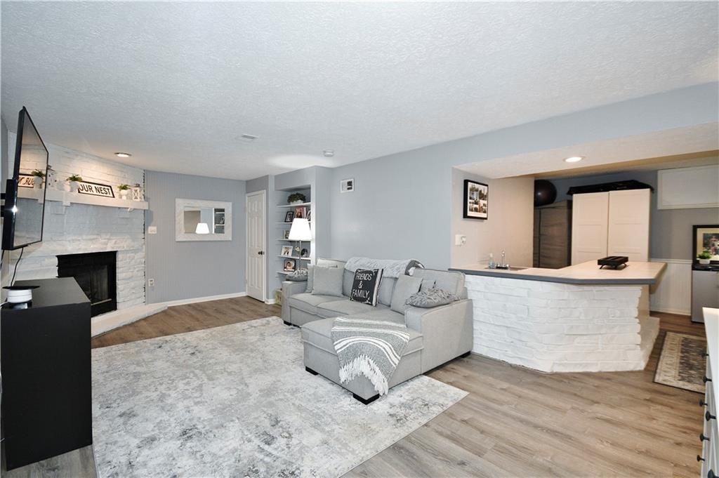 1125 Valleyview Drive Lawrence, PA 15055 - Photo 28 of 35 a living room with furniture and a fireplace