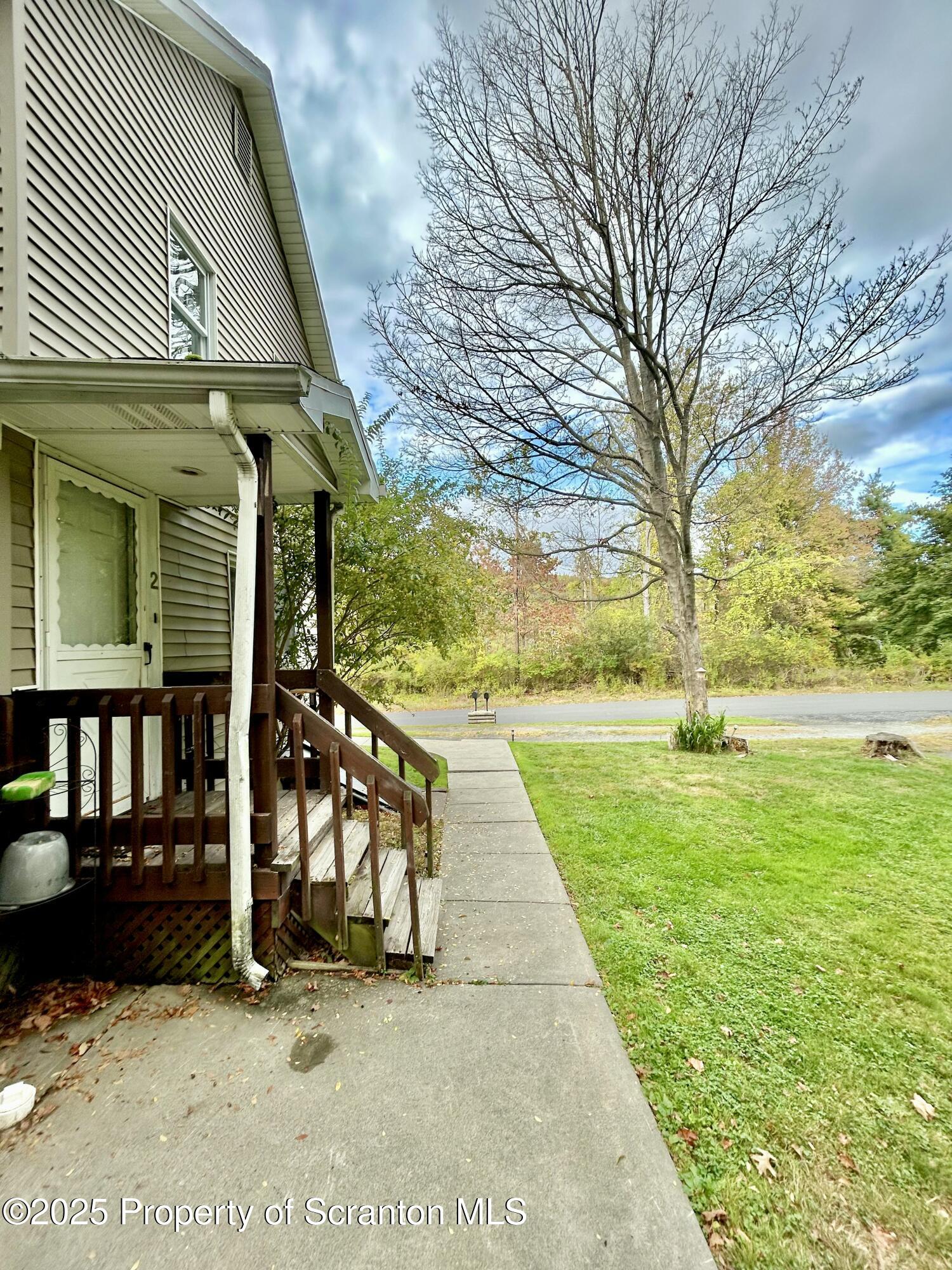 1393 1395 Old Trail Road, Unit 2 Clarks Summit, PA 18411 - Photo 14 of 15 a view of outdoor space and deck