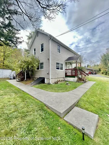 a view of a yard in front of house