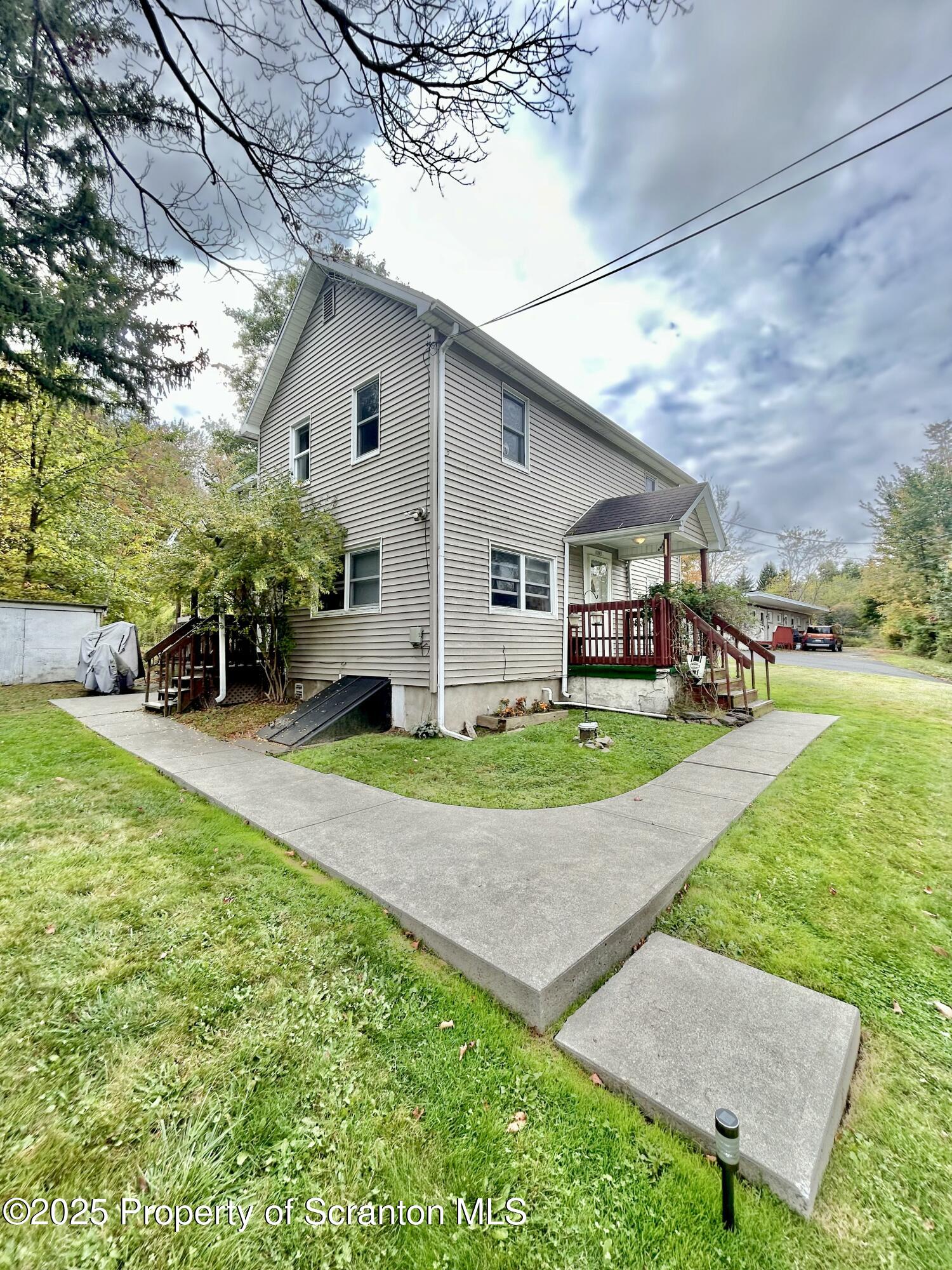 1393 1395 Old Trail Road, Unit 2 Clarks Summit, PA 18411 - Photo 3 of 15 a view of a yard in front of house