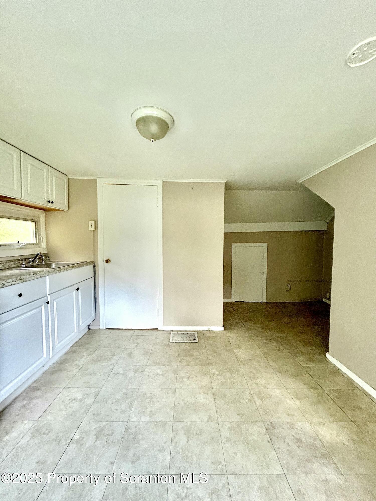 1393 1395 Old Trail Road, Unit 2 Clarks Summit, PA 18411 - Photo 6 of 15 a view of a kitchen with a sink
