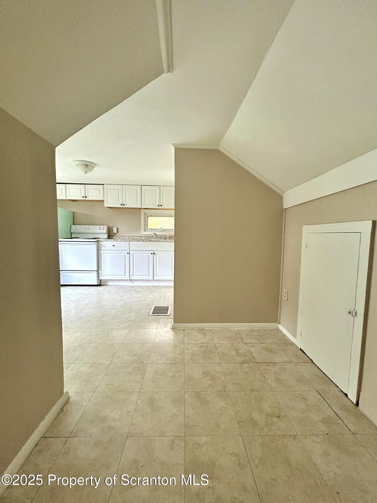 1393 1395 Old Trail Road, Unit 2 Clarks Summit, PA 18411 - Photo 7 of 15 a view of a kitchen with refrigerator and a sink