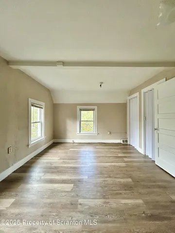 a view of an empty room and window