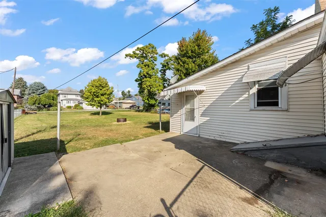 a view of a backyard of the house