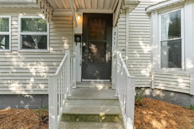a front view of a house with a lake view