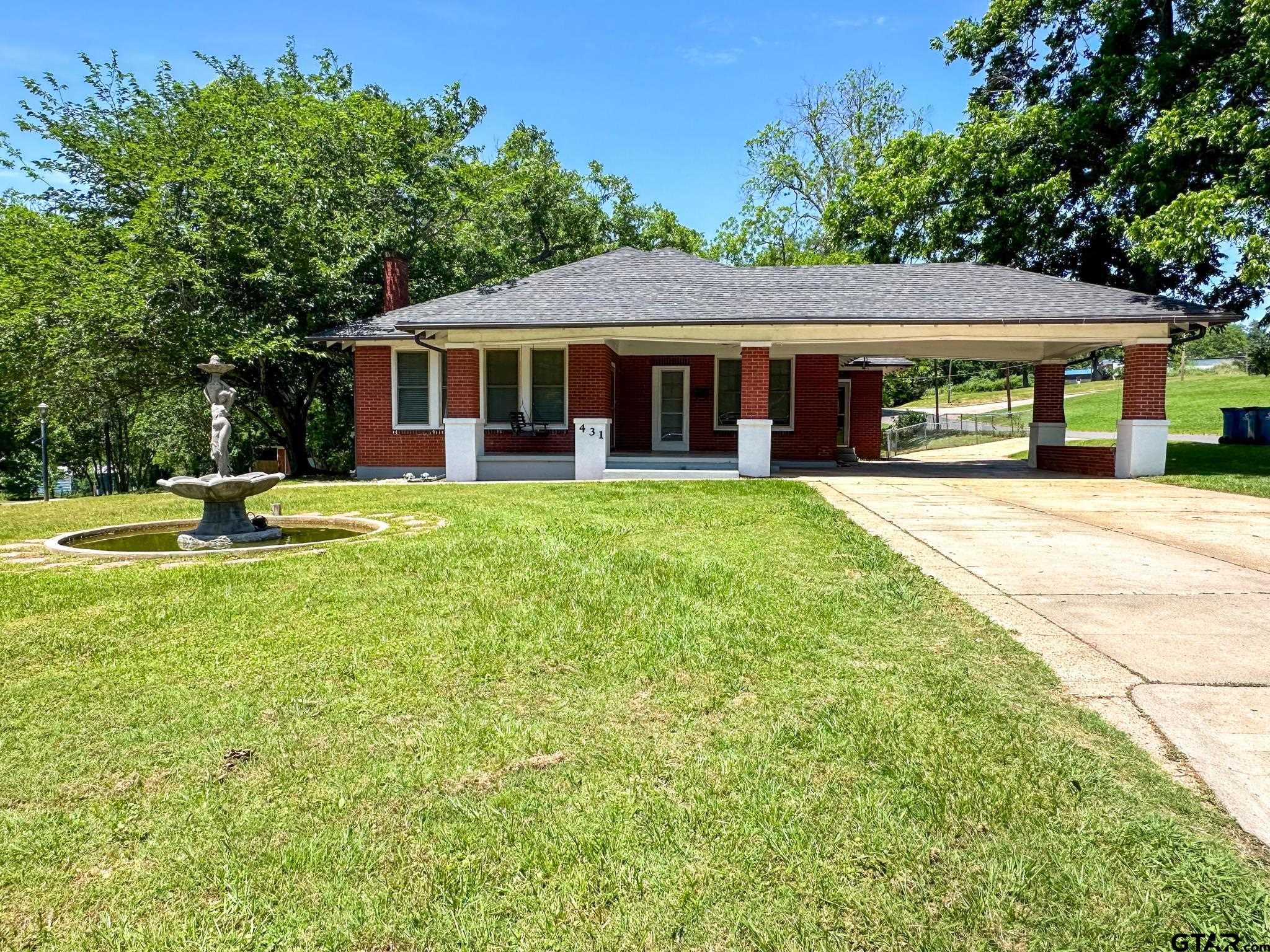431 East 6th Street Rusk, TX 75785 - Photo 1 of 23 a front view of a house with garden