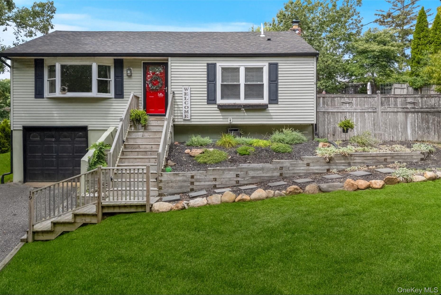 a front view of a house with a yard and porch