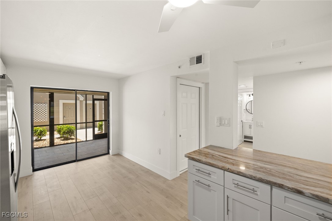 16260 Kelly Cove Drive, Unit 235 Fort Myers, FL 33908 - Photo 14 of 30 a bathroom with a granite countertop sink and a window