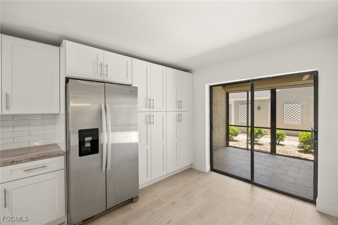 16260 Kelly Cove Drive, Unit 235 Fort Myers, FL 33908 - Photo 15 of 30 an empty room with sliding door and natural light