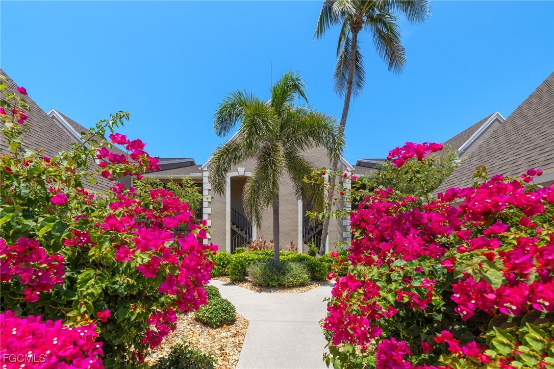 16260 Kelly Cove Drive, Unit 235 Fort Myers, FL 33908 - Photo 2 of 30 a view of a flower in a flower in a lot of flower in a yard