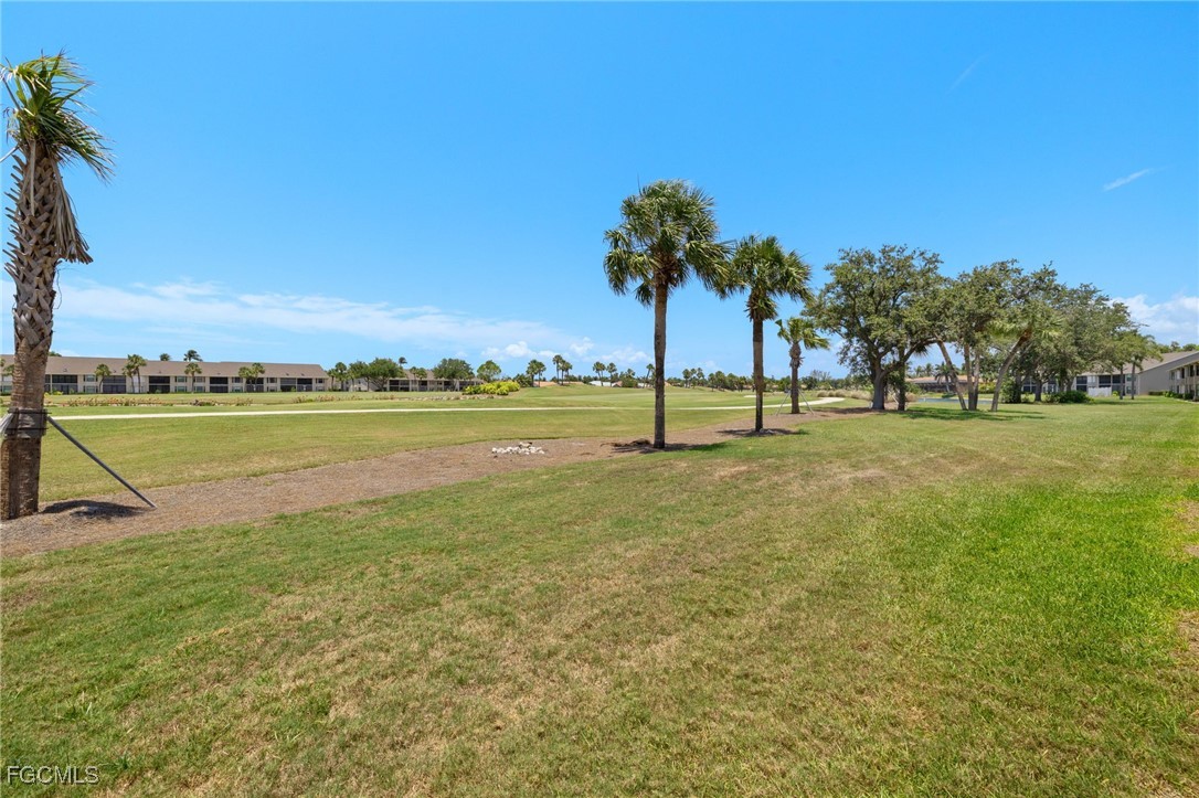 16260 Kelly Cove Drive, Unit 235 Fort Myers, FL 33908 - Photo 30 of 30 a view of a water with palm trees
