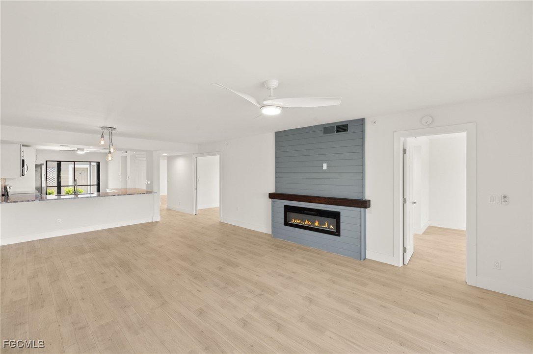 16260 Kelly Cove Drive, Unit 235 Fort Myers, FL 33908 - Photo 8 of 30 a view of a livingroom with a fireplace