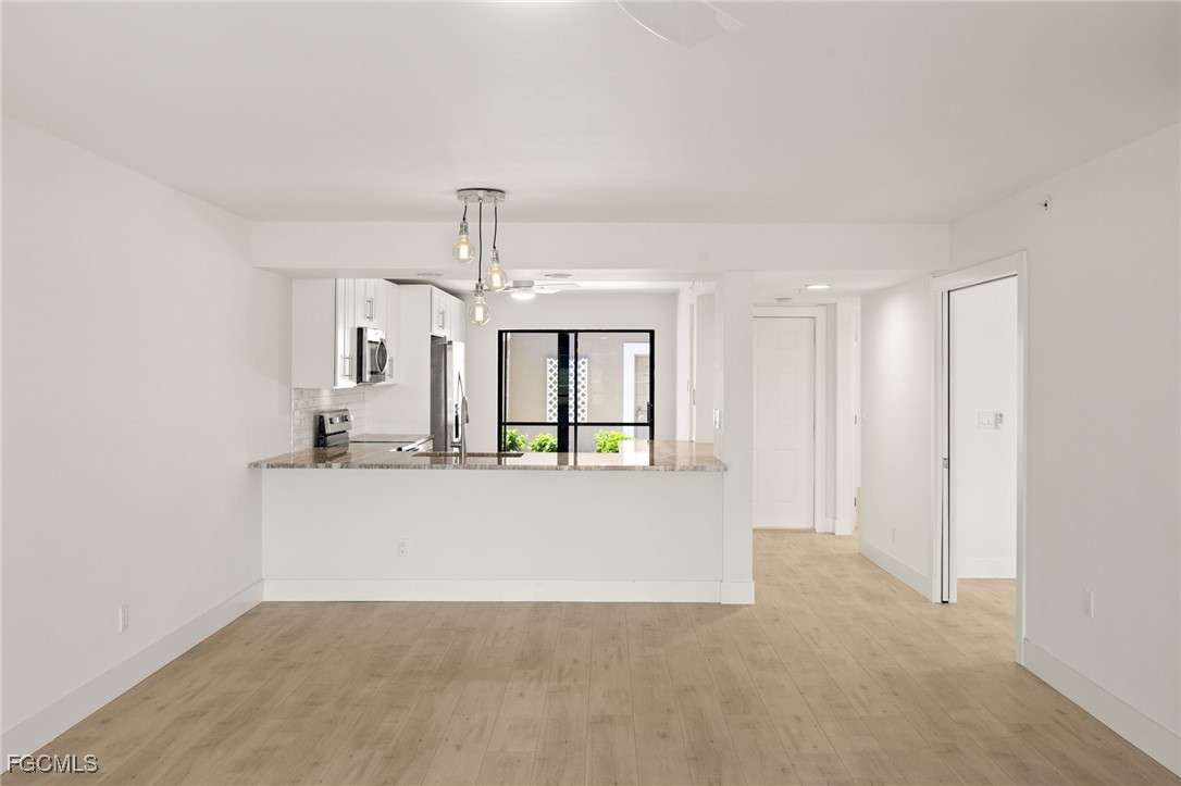 16260 Kelly Cove Drive, Unit 235 Fort Myers, FL 33908 - Photo 10 of 30 a view of kitchen and living room