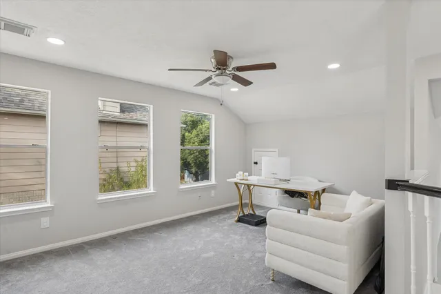 a work room with furniture and windows
