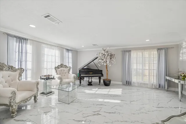 a living room with furniture and a large window