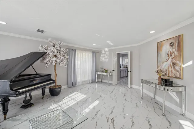 a view of a livingroom with furniture and a window