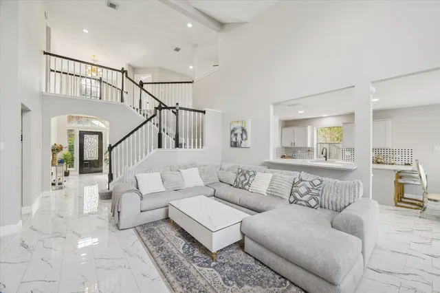 a living room with furniture and white walls