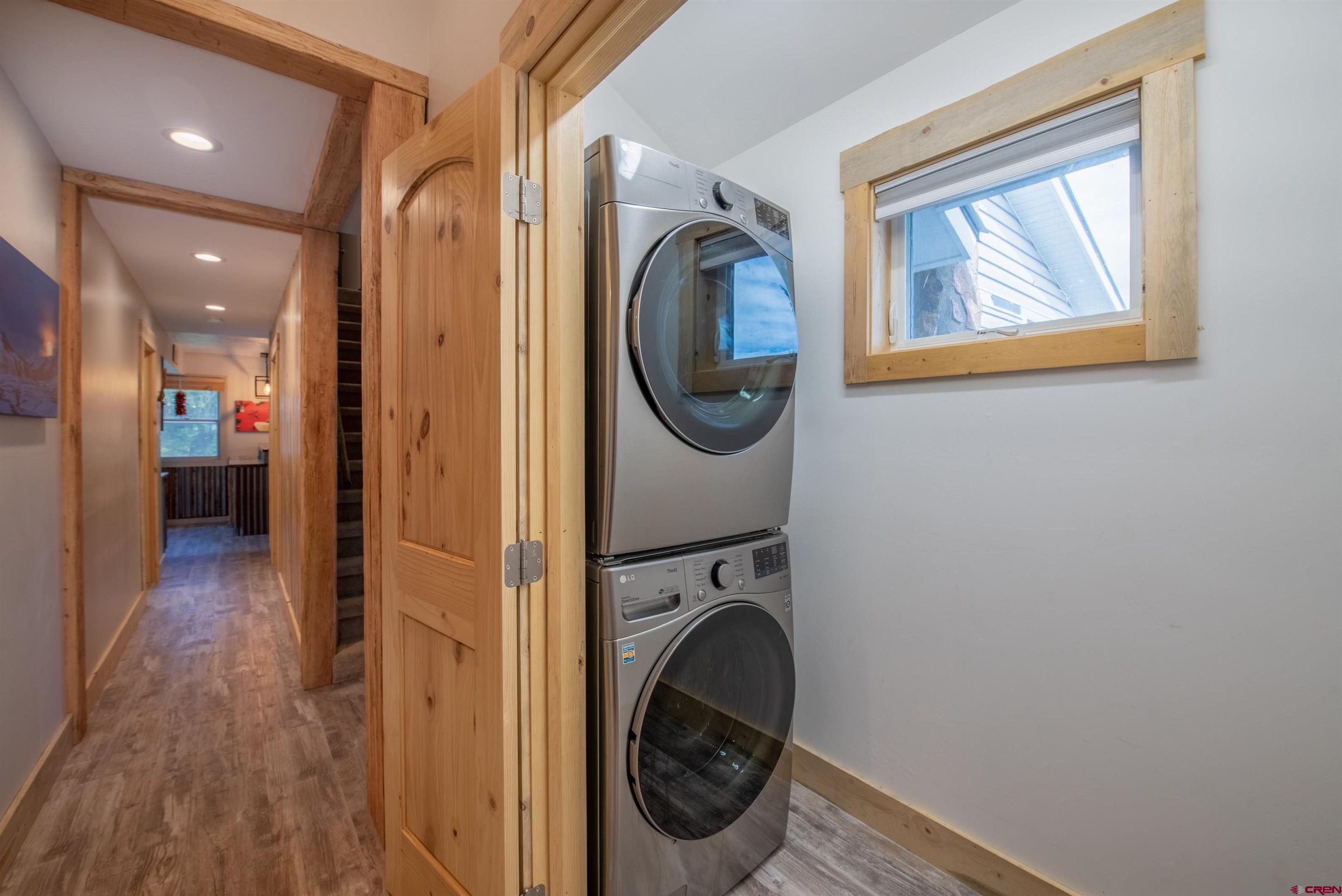 15 Debby Way Gunnison, CO 81230 - Photo 11 of 34 a view of a hallway with washer and dryer
