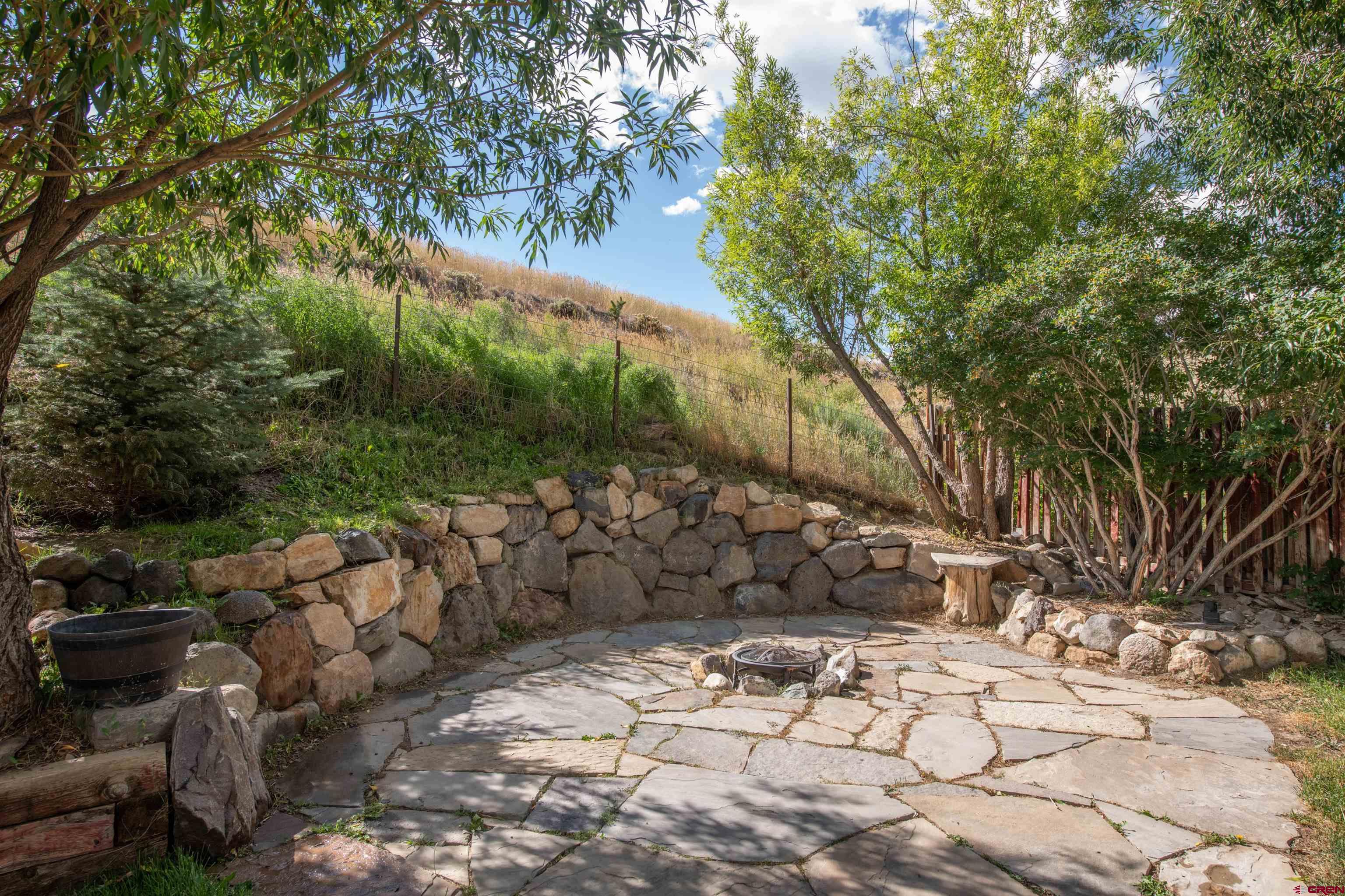 15 Debby Way Gunnison, CO 81230 - Photo 13 of 34 a view of a yard with plants and trees