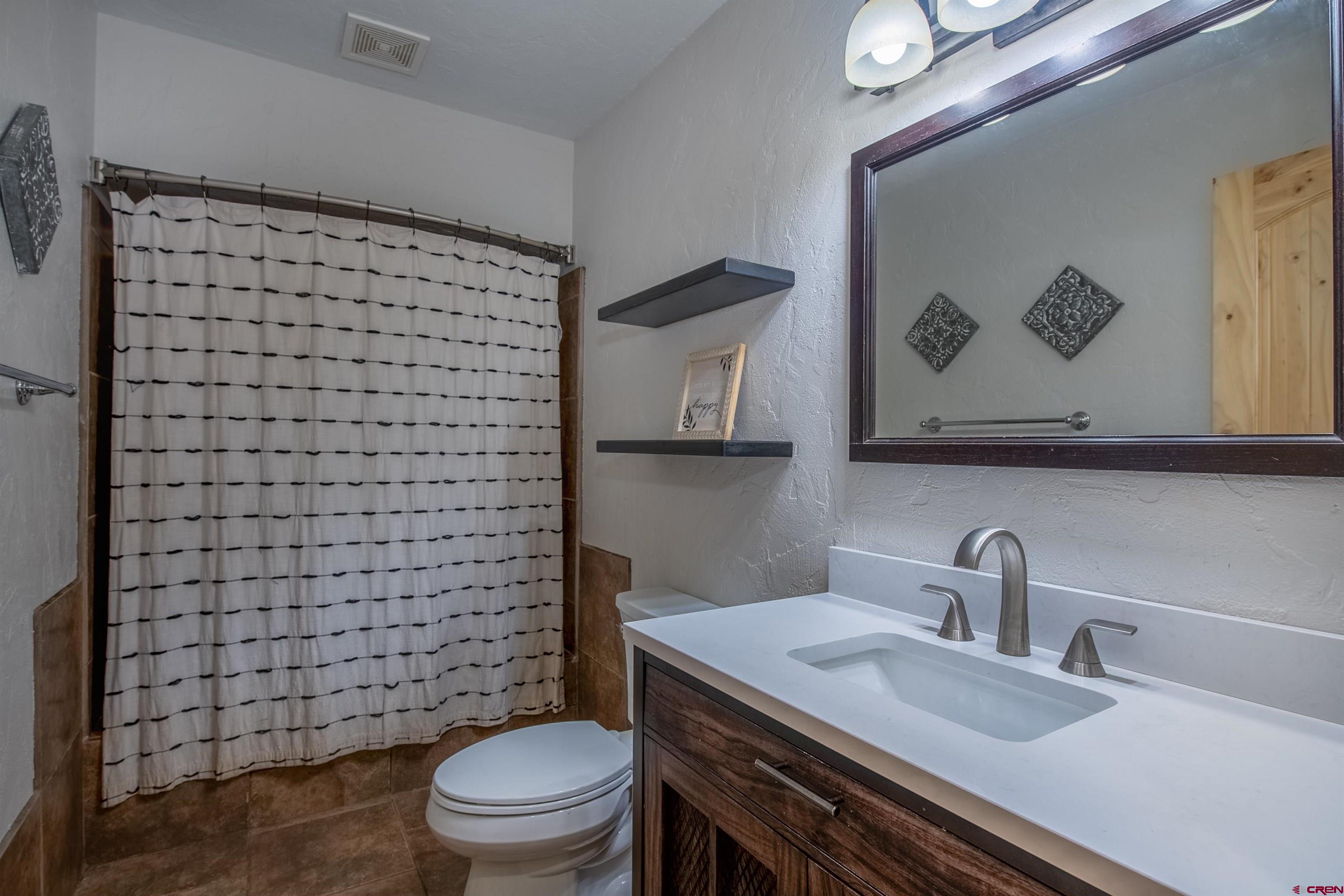 15 Debby Way Gunnison, CO 81230 - Photo 22 of 34 a bathroom with a sink and a toilet