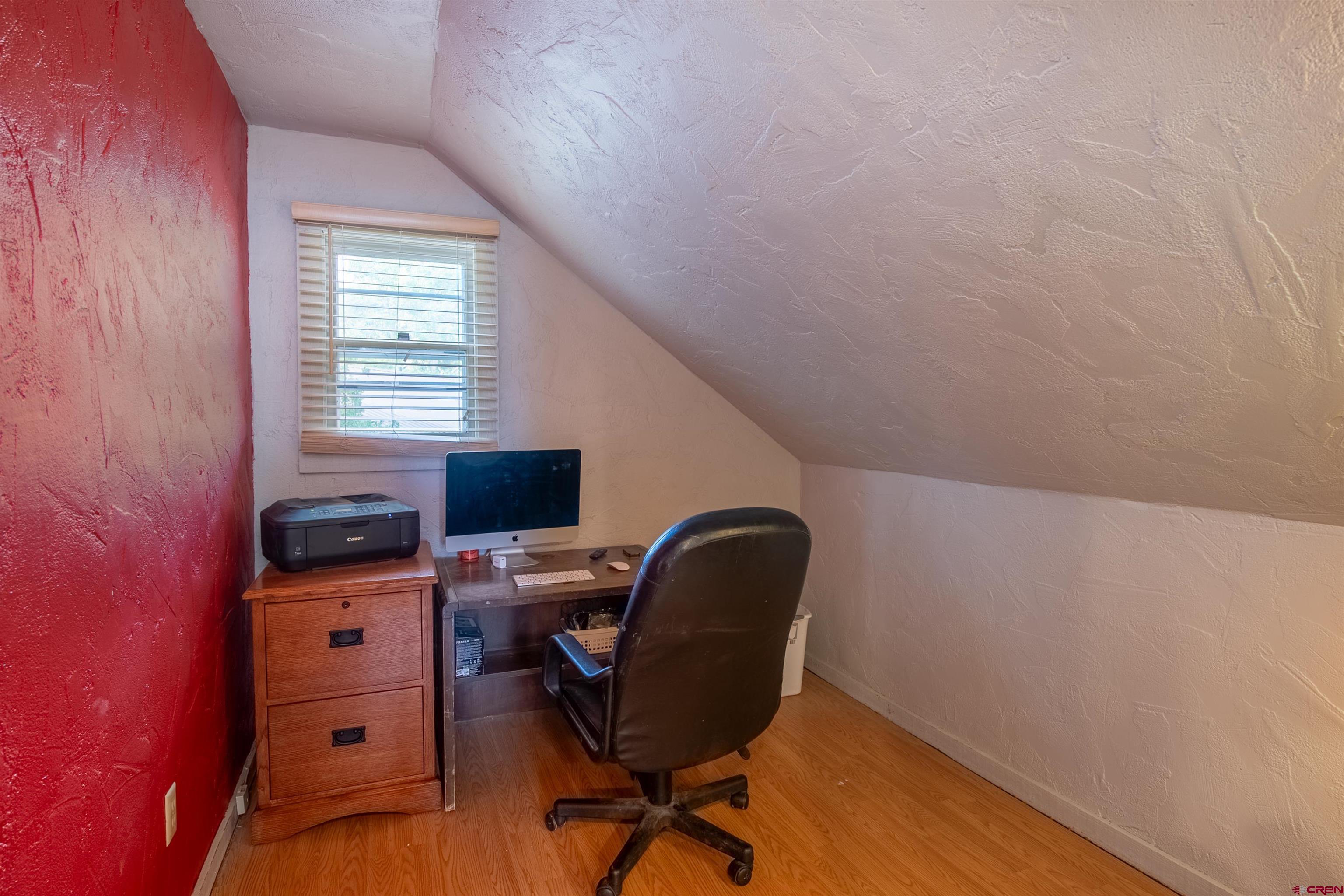 15 Debby Way Gunnison, CO 81230 - Photo 23 of 34 a view of a workspace with furniture and a window