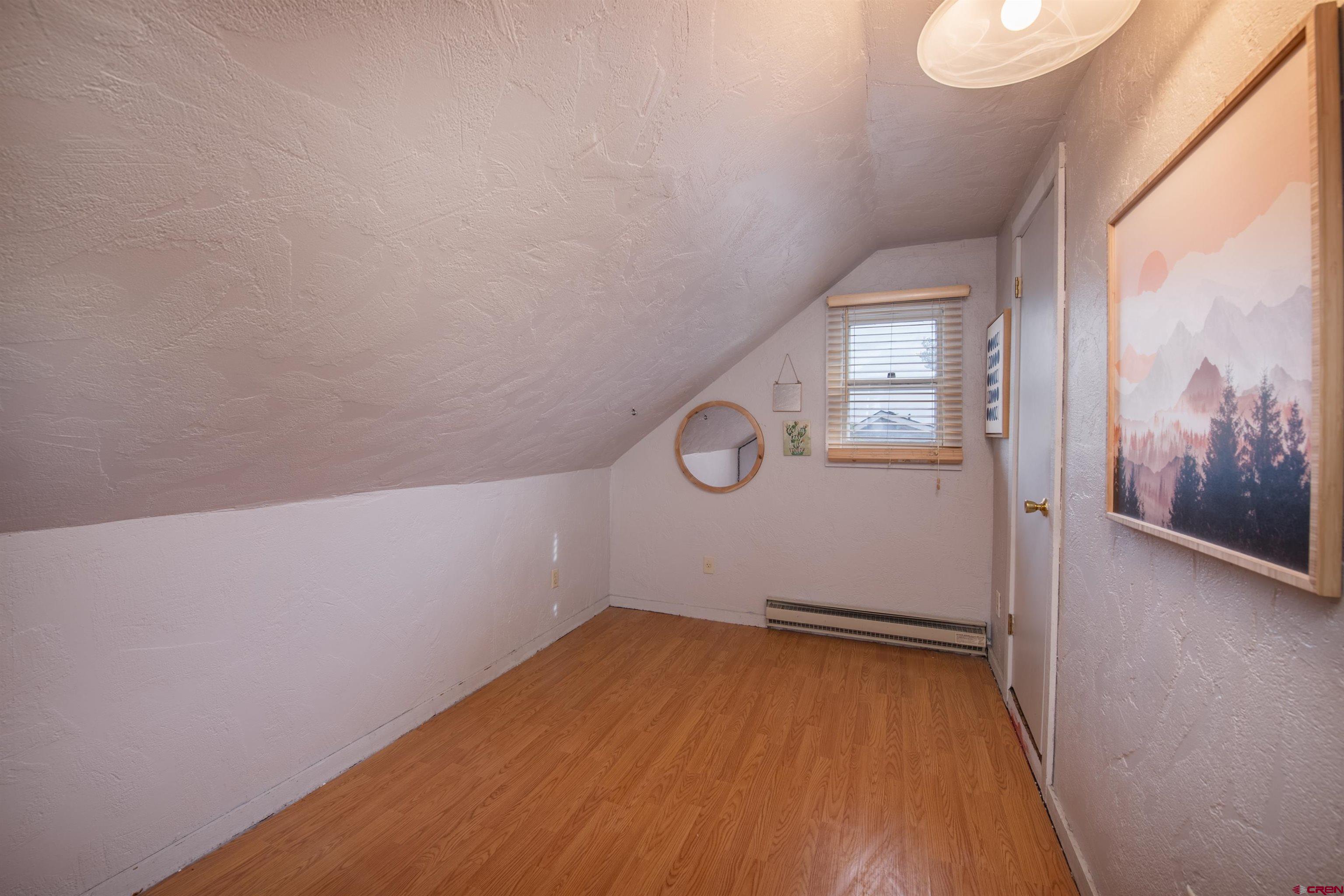 15 Debby Way Gunnison, CO 81230 - Photo 24 of 34 a view of a room with wooden floor and small window