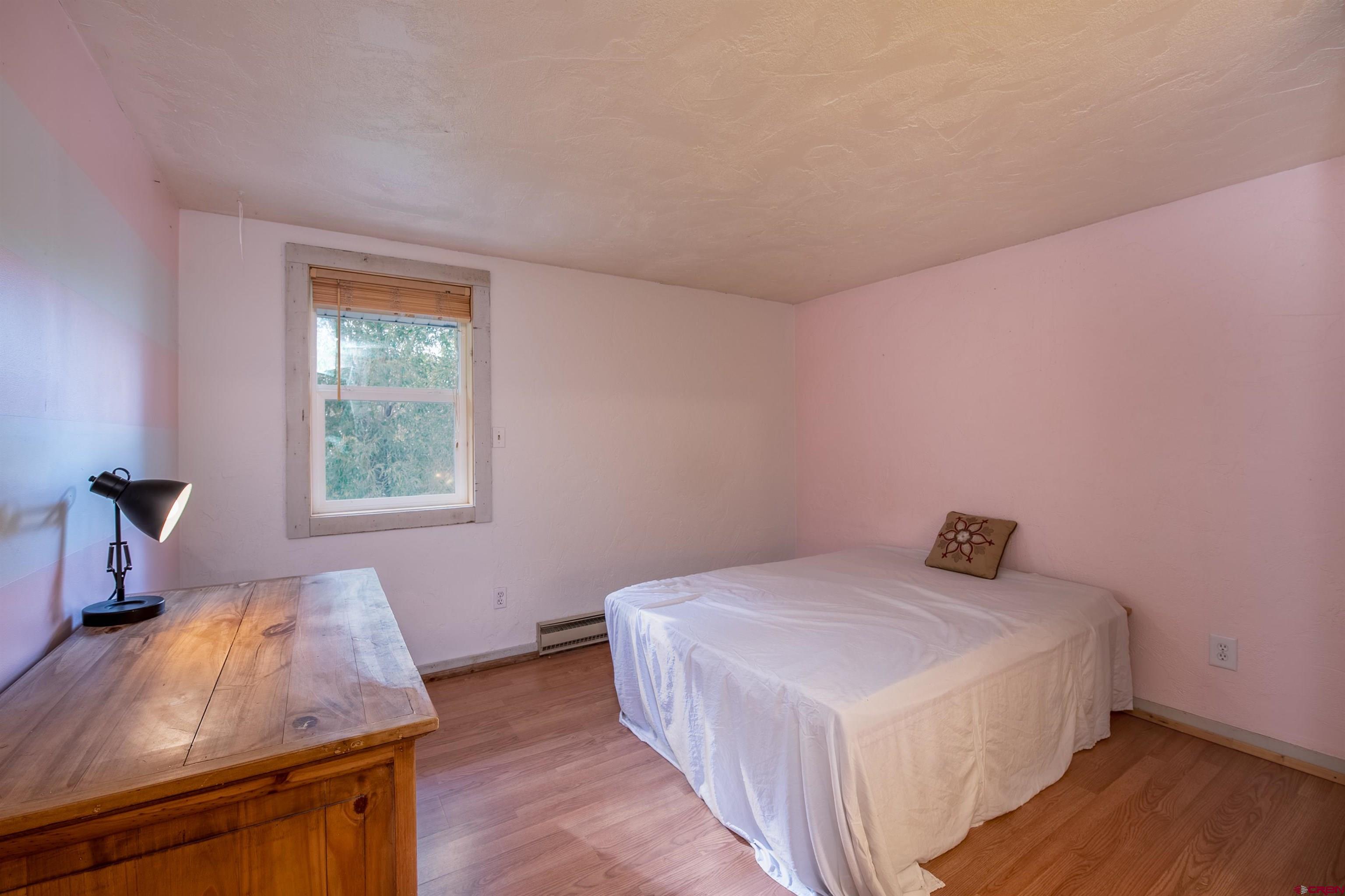 15 Debby Way Gunnison, CO 81230 - Photo 26 of 34 a bedroom with a bed and a window