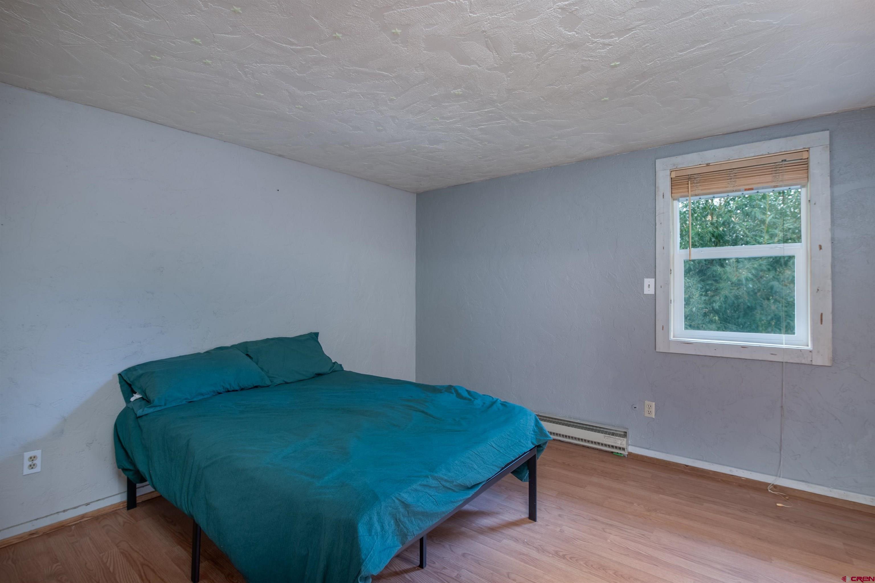 15 Debby Way Gunnison, CO 81230 - Photo 27 of 34 a bedroom with a bed and a window