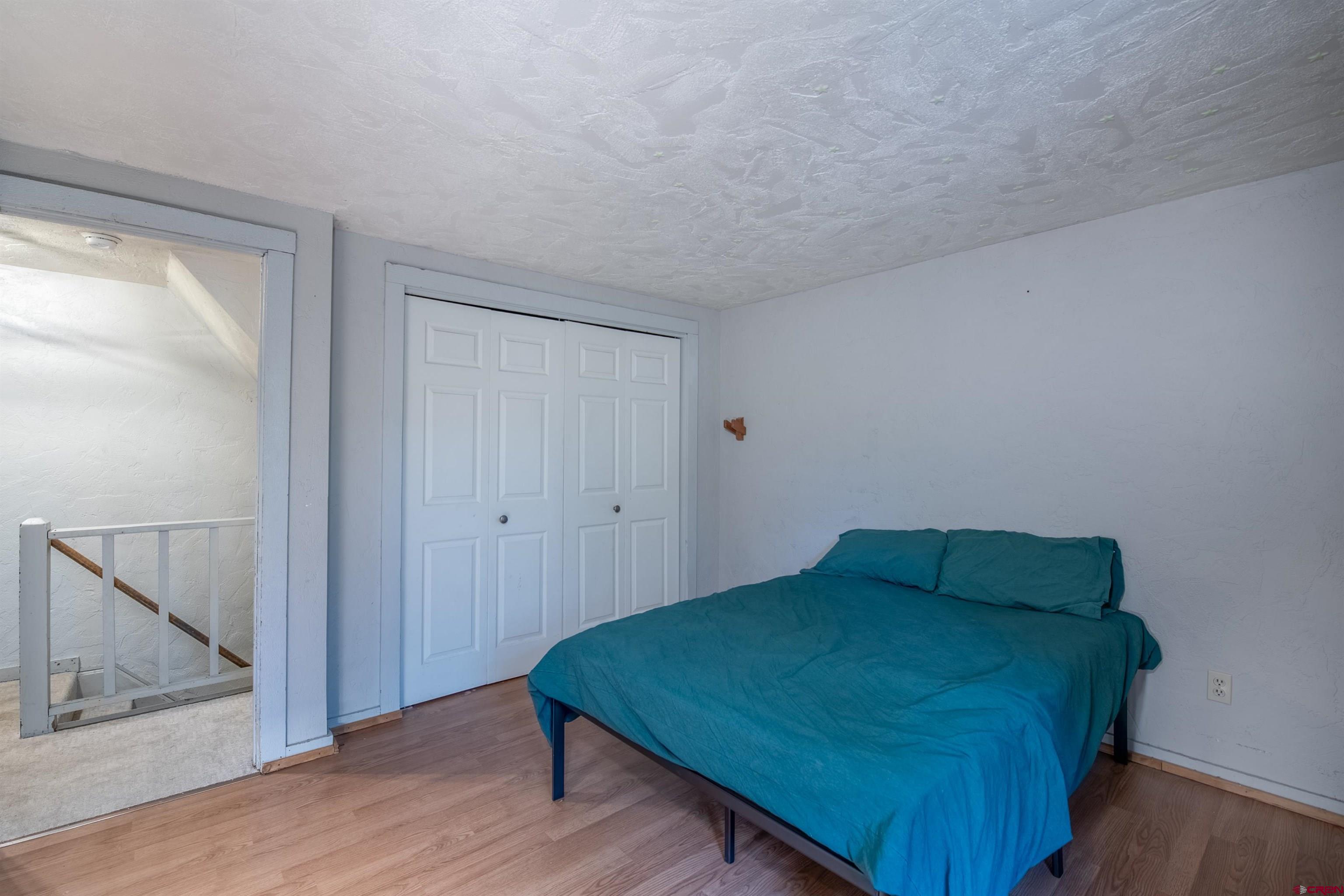 15 Debby Way Gunnison, CO 81230 - Photo 28 of 34 a bedroom with a bed and a window
