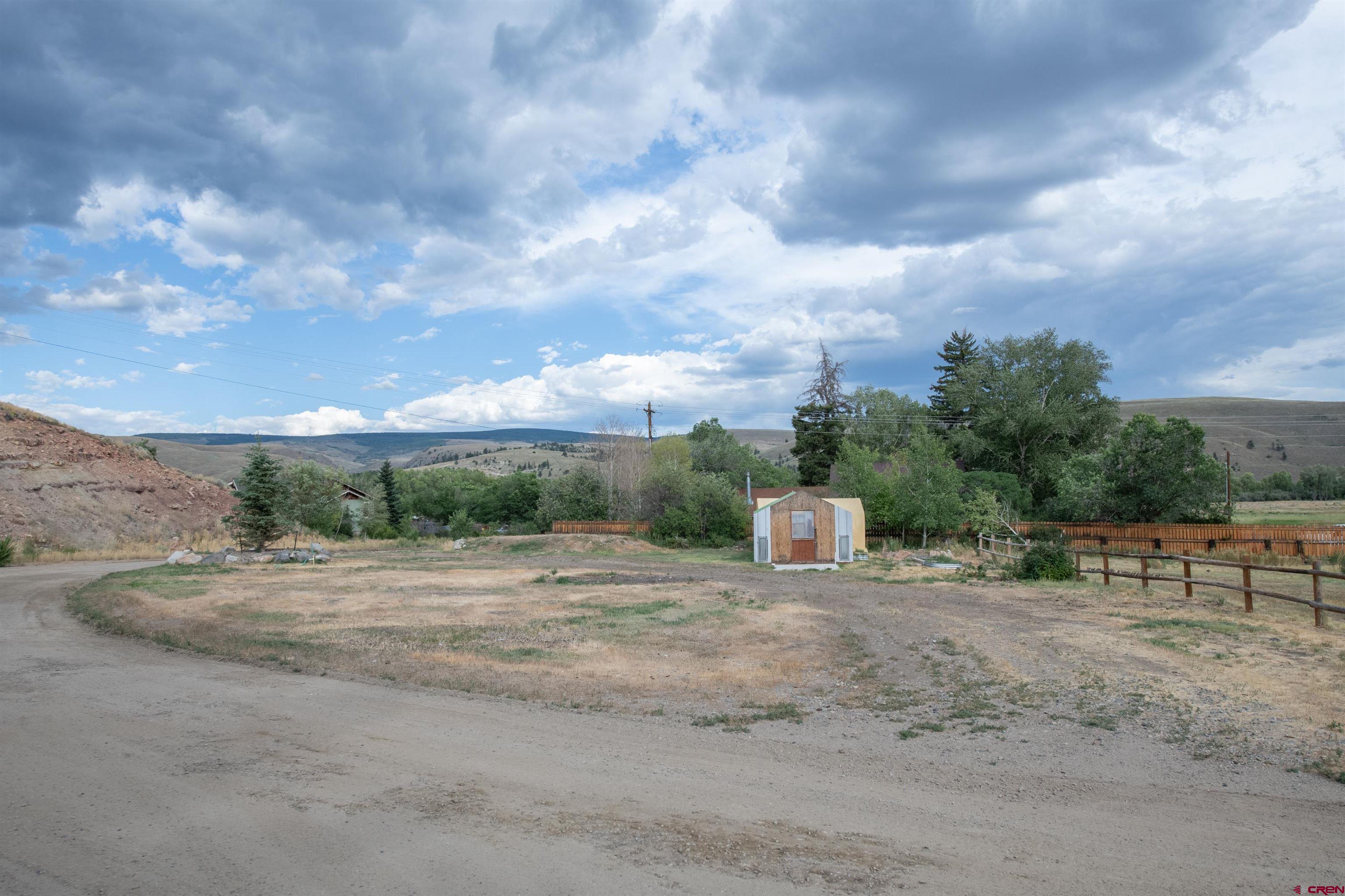 15 Debby Way Gunnison, CO 81230 - Photo 29 of 34 a view of a dry yard with wooden fence