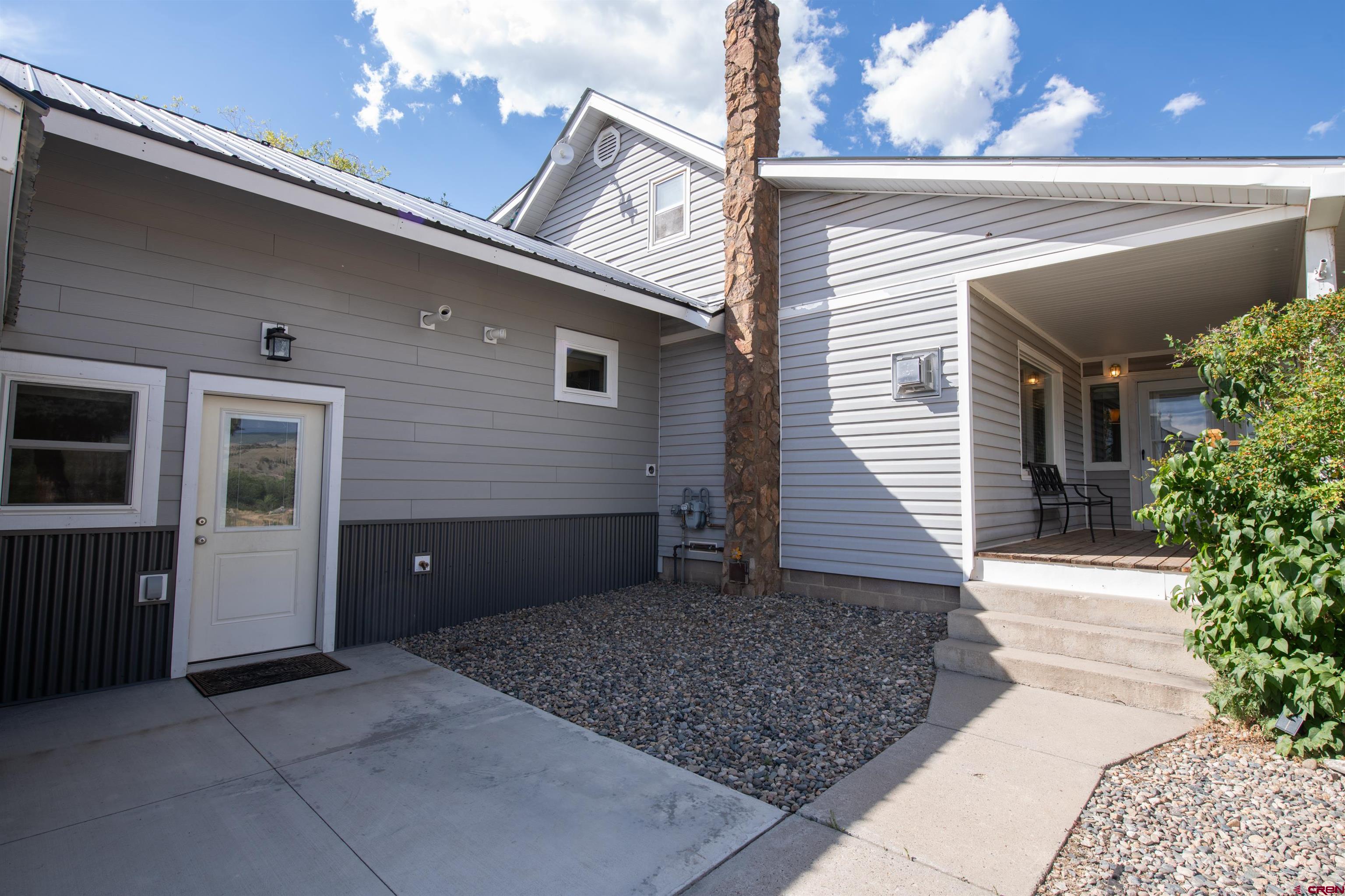 15 Debby Way Gunnison, CO 81230 - Photo 3 of 34 a view of a house with a yard and garage