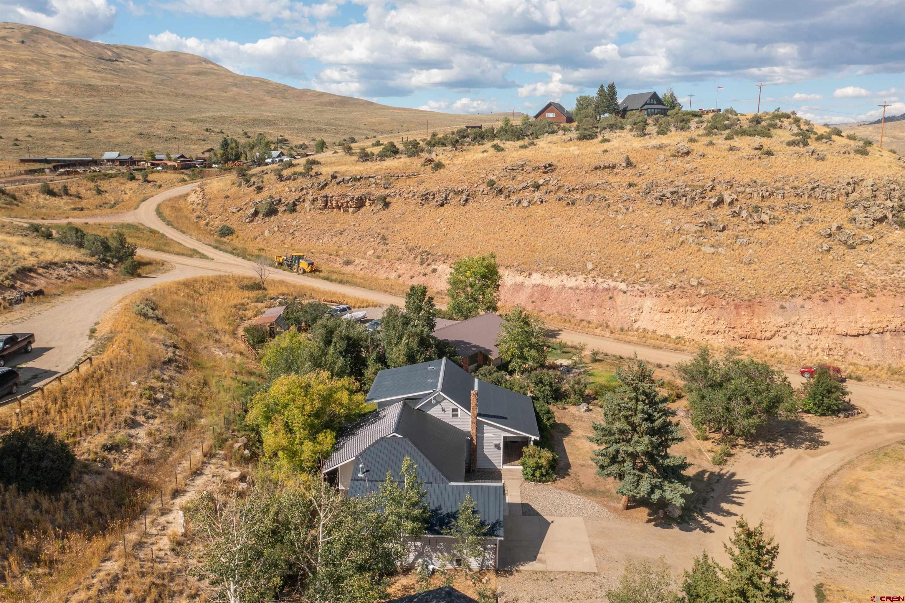 15 Debby Way Gunnison, CO 81230 - Photo 31 of 34 an aerial view of a house with a yard and mountain view in back