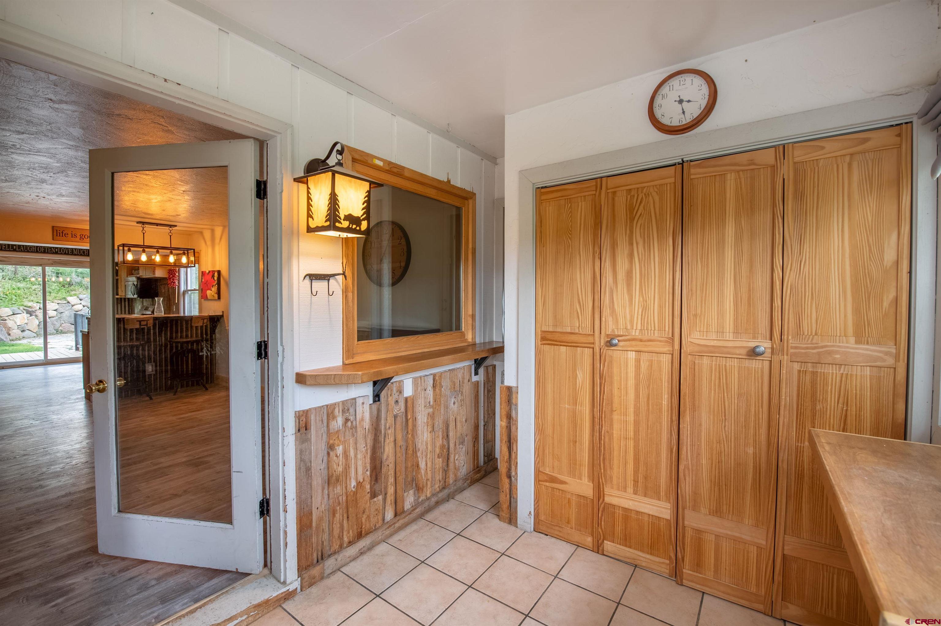 15 Debby Way Gunnison, CO 81230 - Photo 5 of 34 a view of a hallway with wooden floor and a bathroom