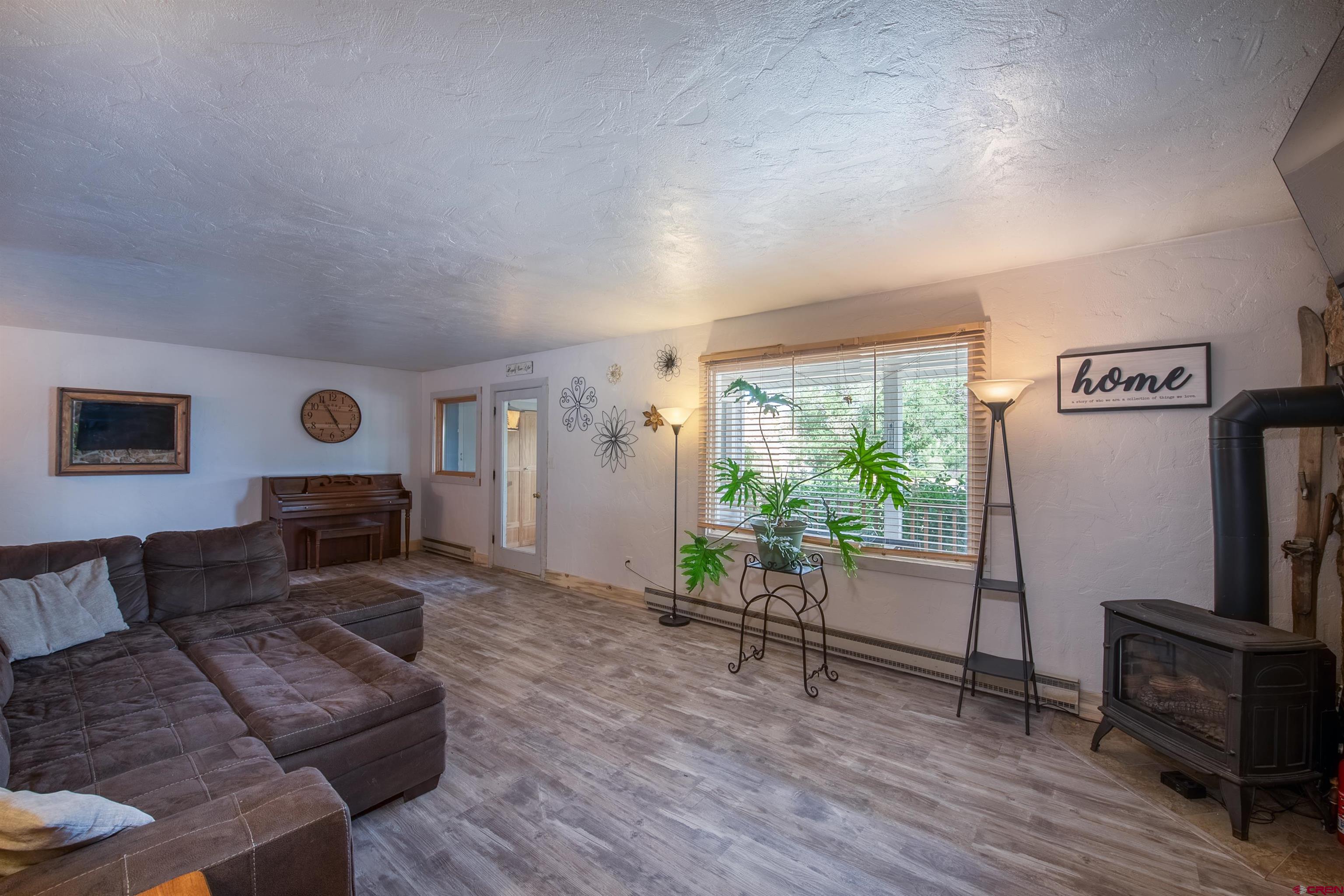15 Debby Way Gunnison, CO 81230 - Photo 10 of 34 a living room with furniture and a flat screen tv