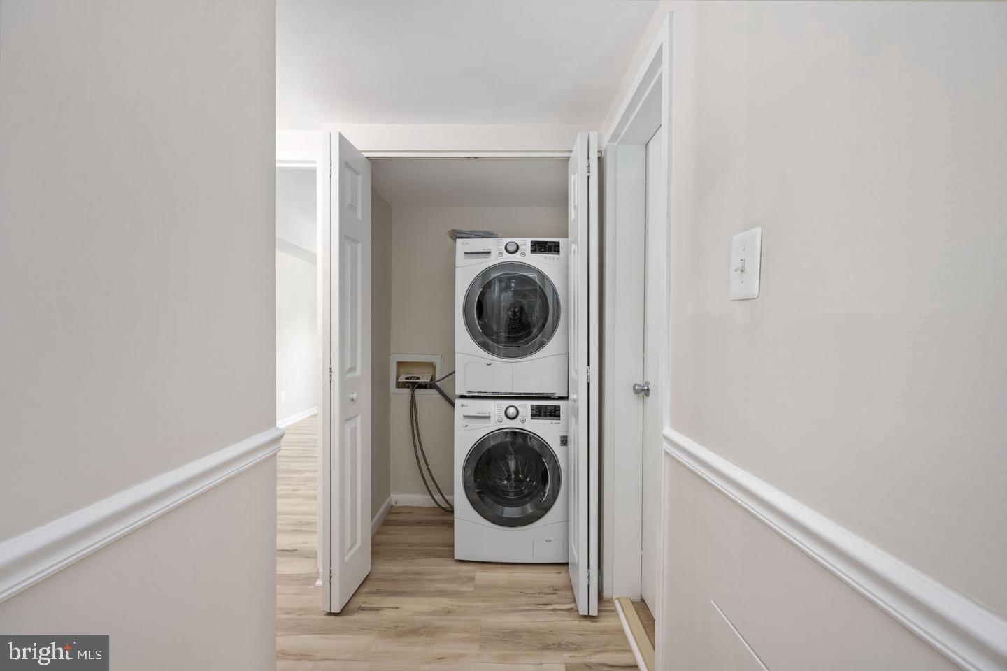 11659 Stoneview Square, Unit 11C Reston, VA 20191 - Photo 16 of 32 Efficient laundry nook in modern home.