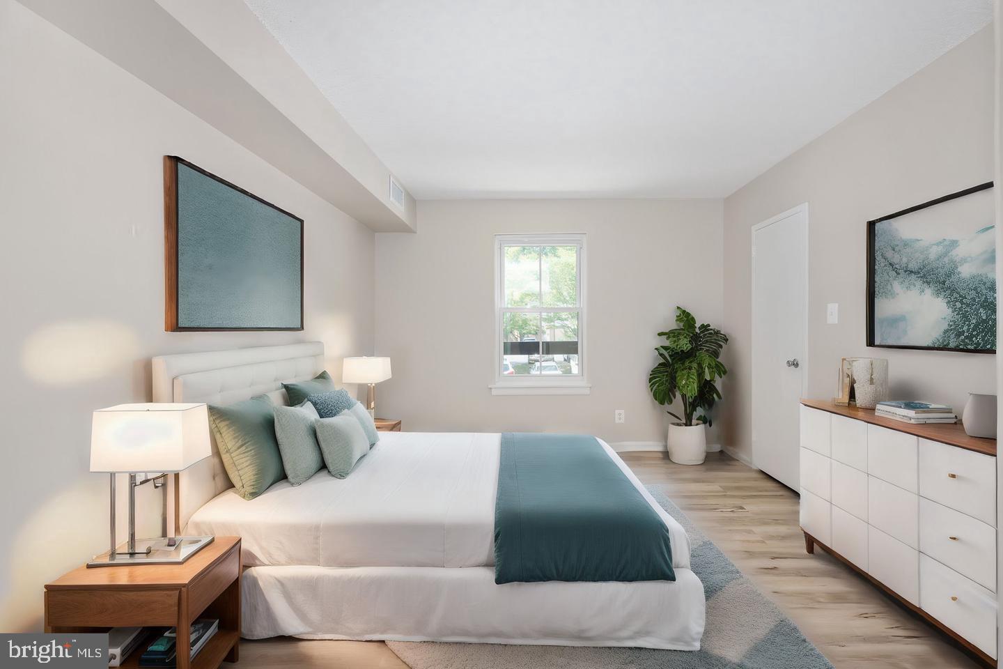 11659 Stoneview Square, Unit 11C Reston, VA 20191 - Photo 17 of 32 Serene bedroom with natural light.