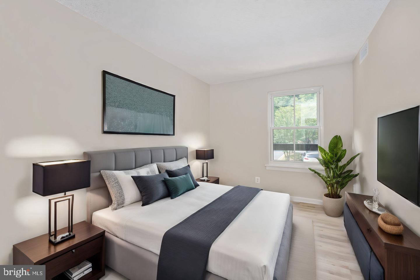 11659 Stoneview Square, Unit 11C Reston, VA 20191 - Photo 2 of 32 Serene bedroom with natural light.