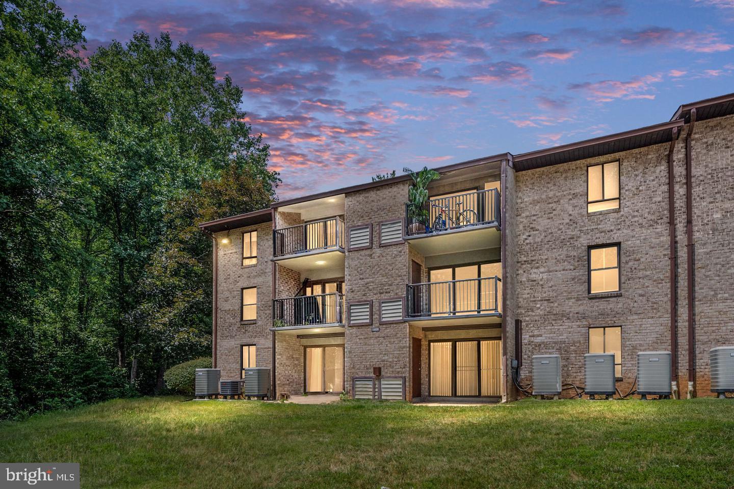 11659 Stoneview Square, Unit 11C Reston, VA 20191 - Photo 28 of 32 Charming brick apartment at dusk.