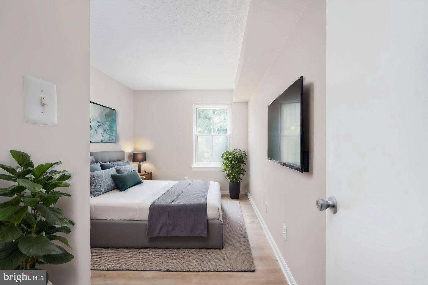 11659 Stoneview Square, Unit 11C Reston, VA 20191 - Photo 3 of 32 Serene bedroom with natural light.