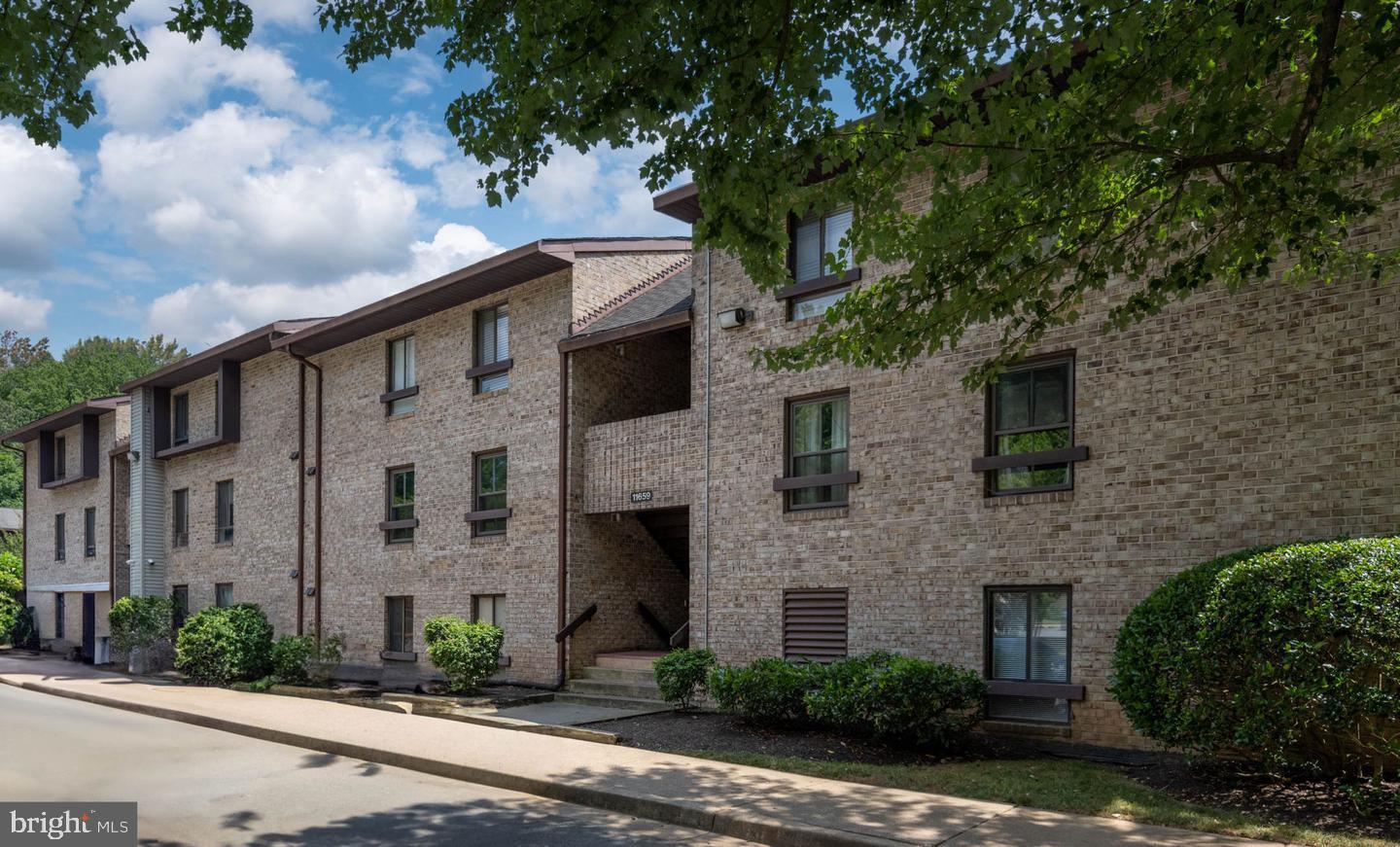 11659 Stoneview Square, Unit 11C Reston, VA 20191 - Photo 32 of 32 Charming brick apartment complex exterior.