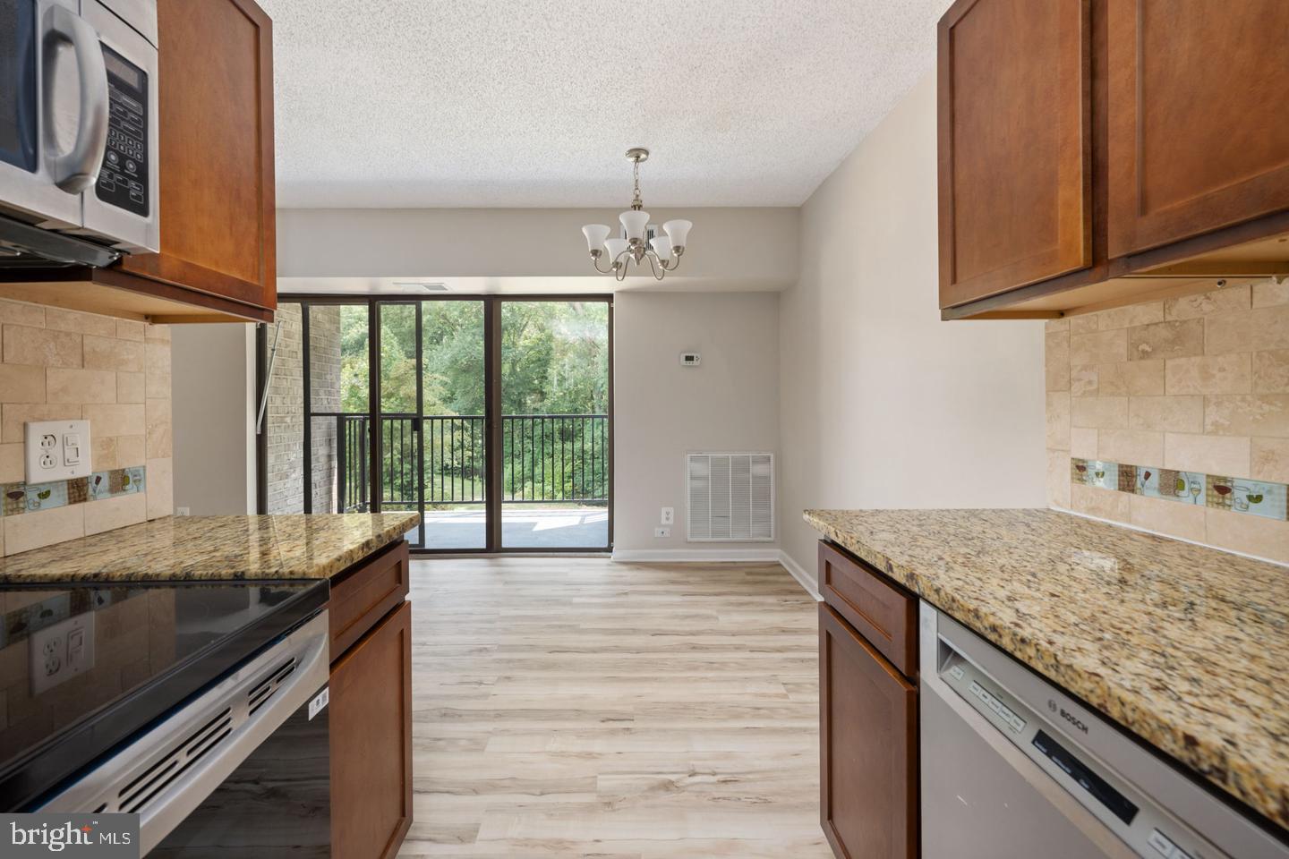 11659 Stoneview Square, Unit 11C Reston, VA 20191 - Photo 8 of 32 Bright and airy kitchen with views.