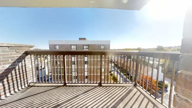 a view of a balcony with wooden floor