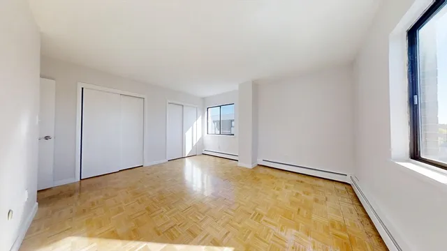 a view of an empty room with a window