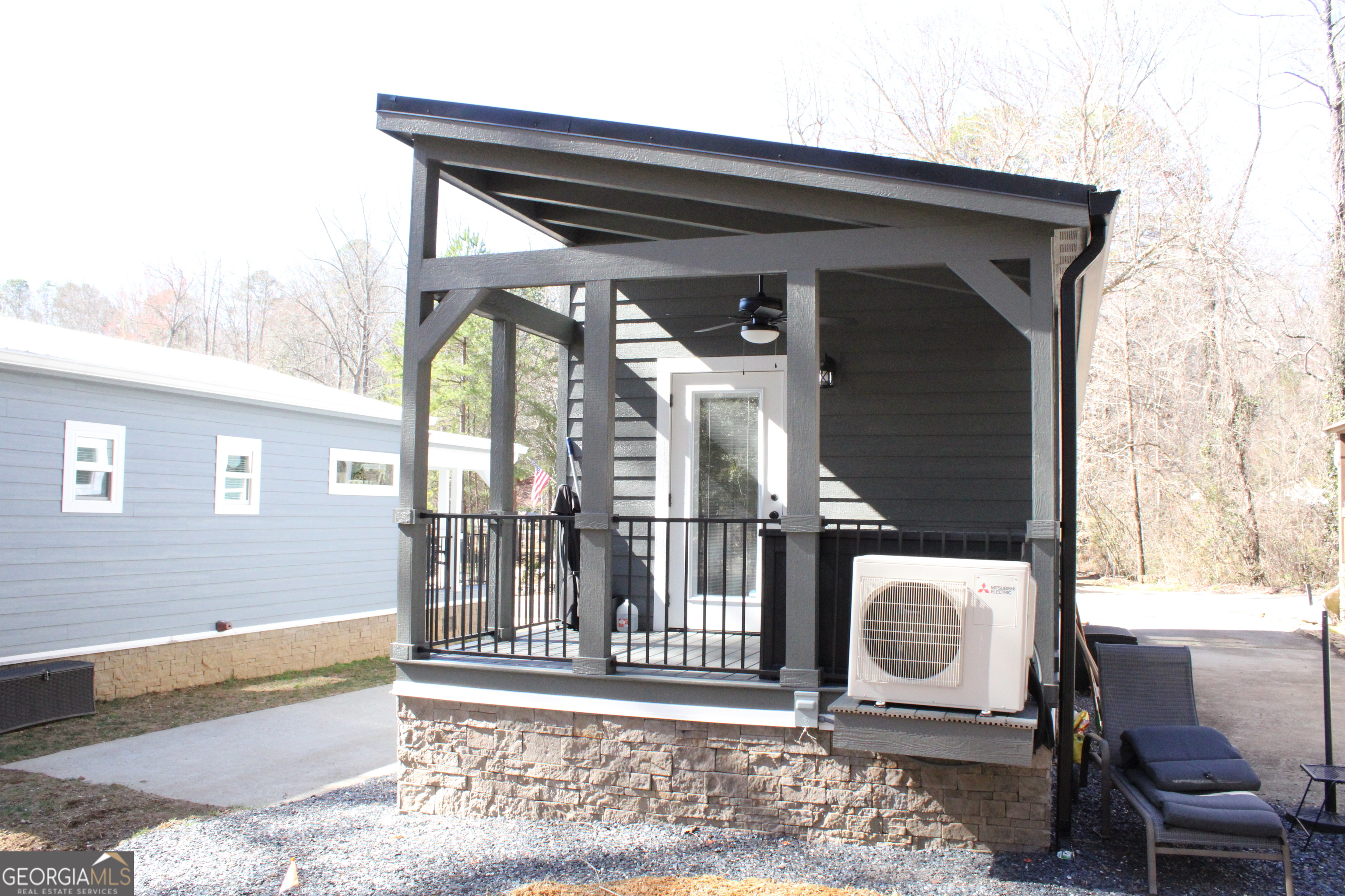 4960 Laurel Lodge Road, Unit 46 Clarkesville, GA 30523 - Photo 16 of 41 a front view of a house with outdoor seating