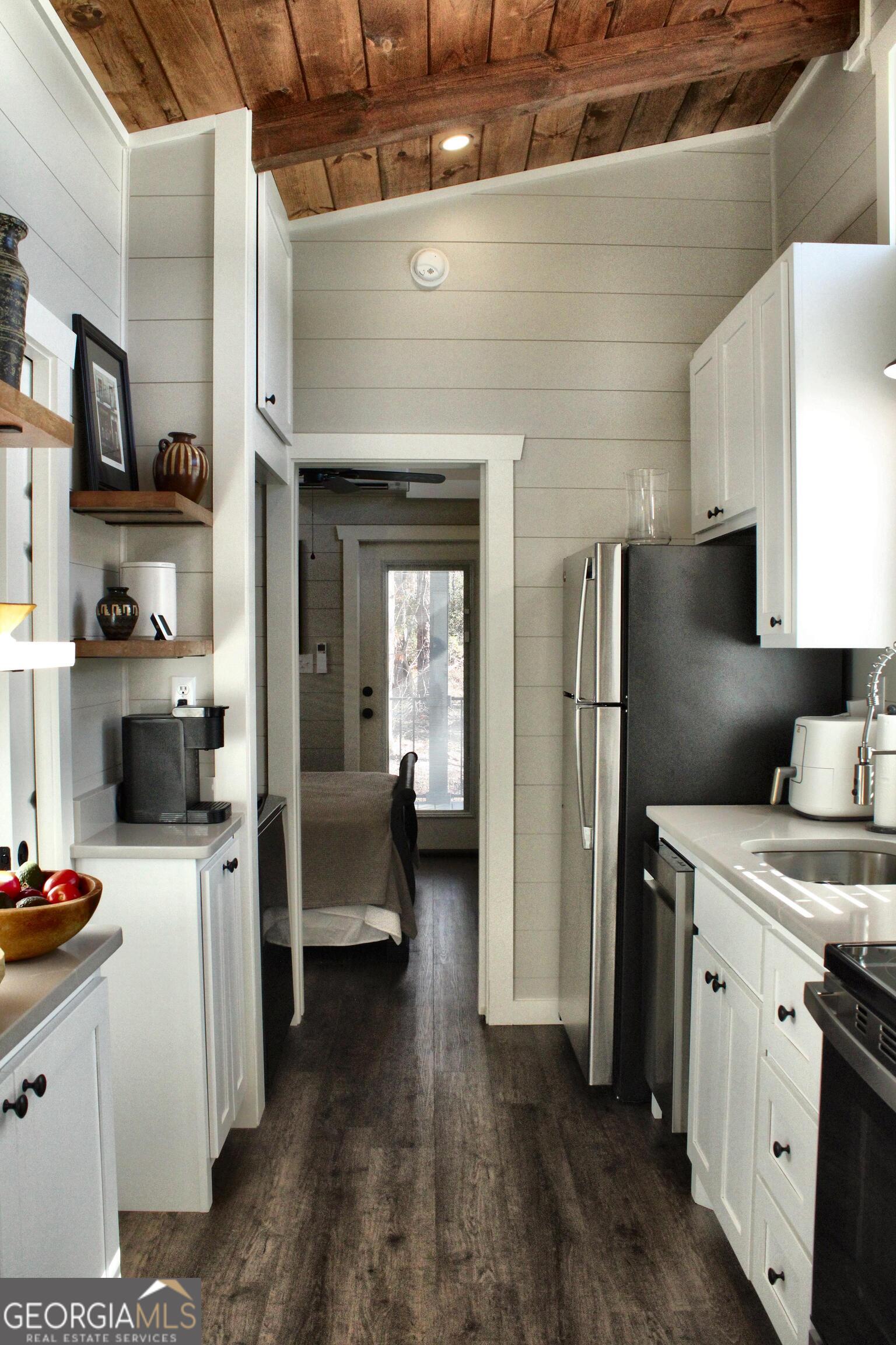 4960 Laurel Lodge Road, Unit 46 Clarkesville, GA 30523 - Photo 18 of 41 a kitchen that has a sink a stove and a refrigerator