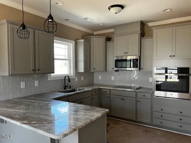 a kitchen with sink cabinets and window