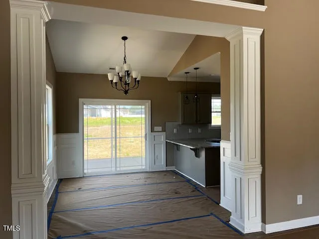 a kitchen with stainless steel appliances granite countertop a stove and a large window