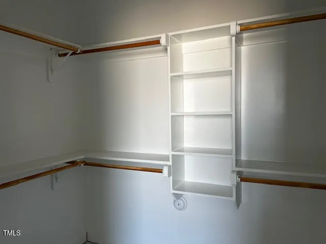 a view of an empty walk in closet